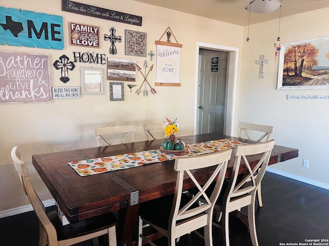 dining area with dark hardwood / wood-style floors