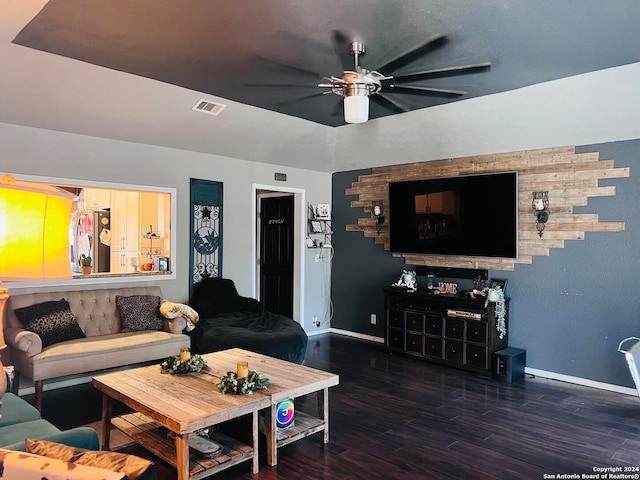 living room with ceiling fan and dark hardwood / wood-style flooring