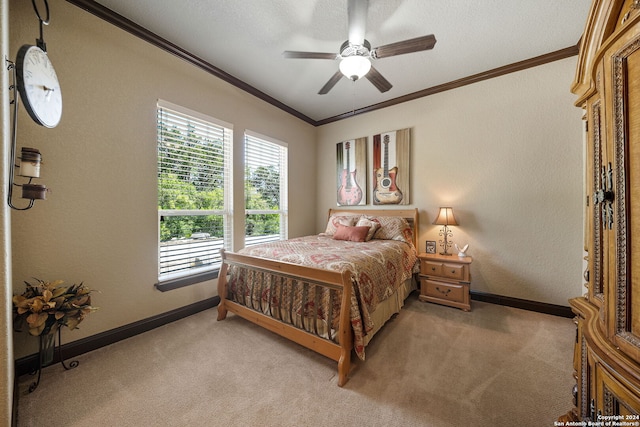 carpeted bedroom with a textured ceiling, crown molding, and ceiling fan