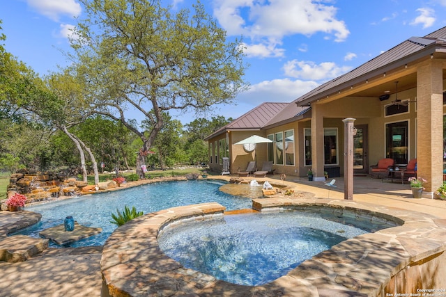 view of pool with a patio, an in ground hot tub, and ceiling fan