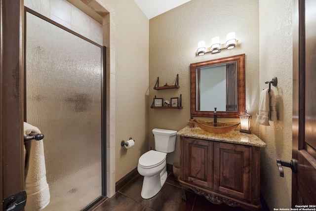 bathroom featuring wood-type flooring, walk in shower, vanity, and toilet