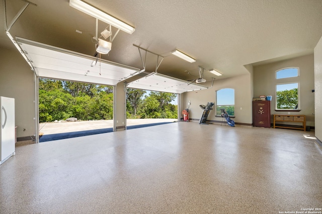 garage featuring a garage door opener