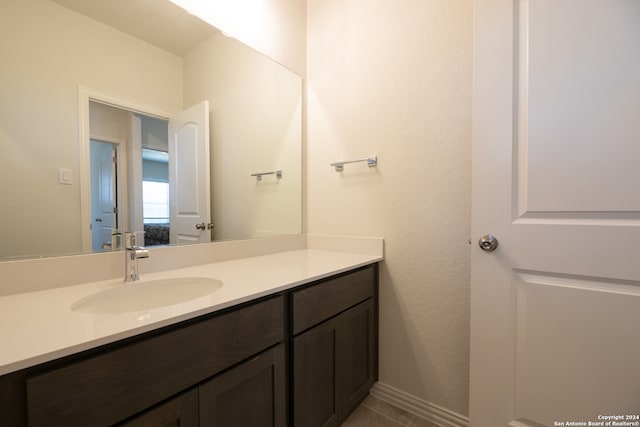 bathroom with vanity and tile patterned flooring