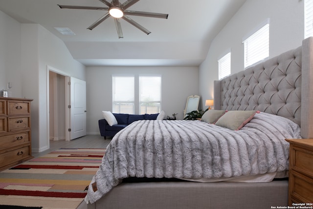 carpeted bedroom with ceiling fan, lofted ceiling, and multiple windows