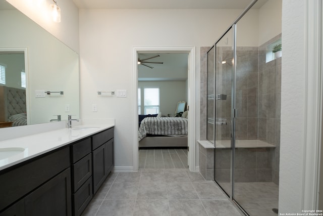 bathroom featuring vanity, ceiling fan, tile patterned floors, and an enclosed shower