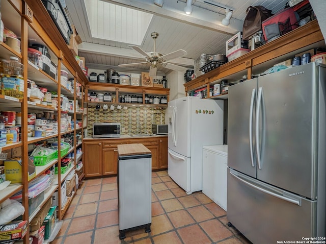 kitchen featuring light tile patterned floors, butcher block counters, ceiling fan, and stainless steel appliances