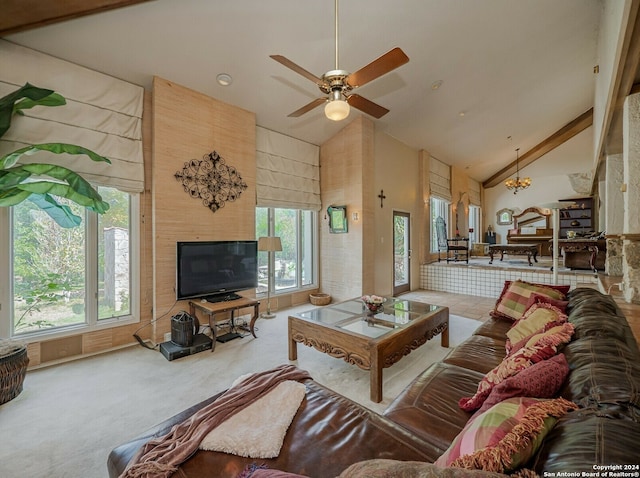 carpeted living room with ceiling fan, high vaulted ceiling, and a wealth of natural light