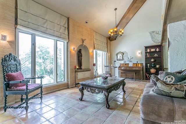 living room featuring high vaulted ceiling, a fireplace, beamed ceiling, and plenty of natural light