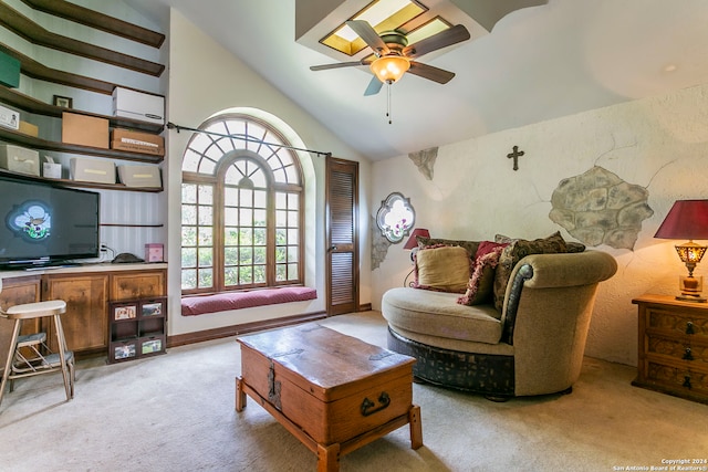 living room with ceiling fan, light colored carpet, and high vaulted ceiling