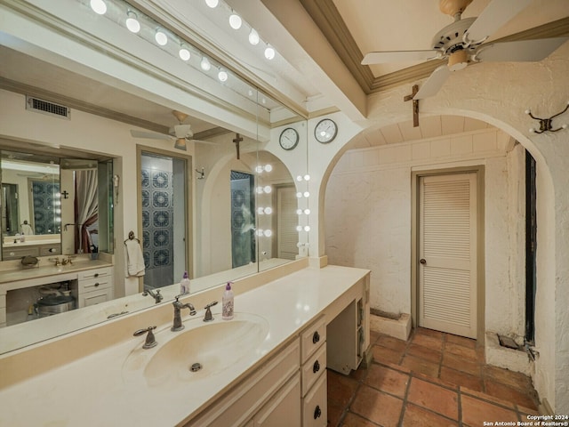 bathroom with ceiling fan, vanity, and ornamental molding