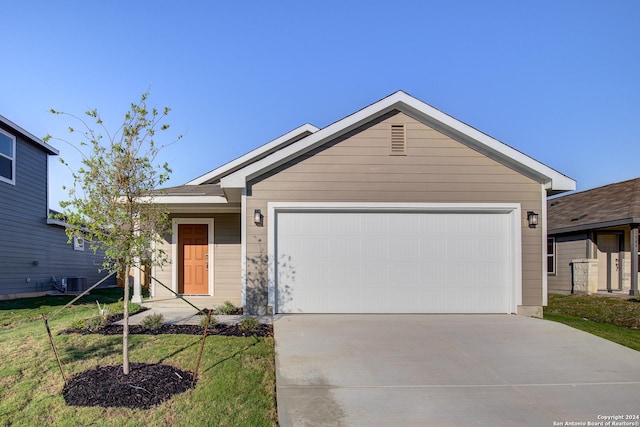 2544 Solon Ln, Seguin, TX 78155 - ranch-style house featuring an attached garage, a front lawn, driveway, and central AC unit