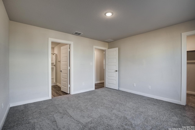 2544 Solon Ln, Seguin, TX 78155 - unfurnished bedroom featuring a spacious closet, baseboards, visible vents, and carpet