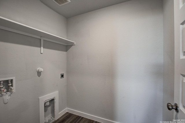2544 Solon Ln, Seguin, TX 78155 - clothes washing area featuring hookup for an electric dryer, laundry area, baseboards, dark wood-type flooring, and visible vents