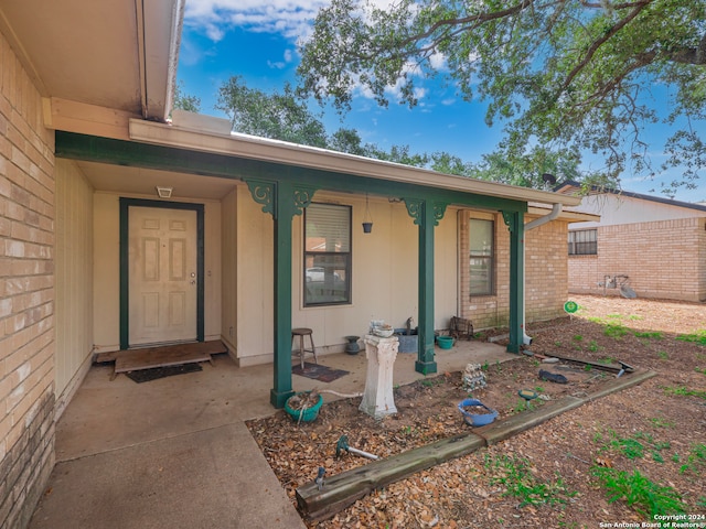 doorway to property with a porch