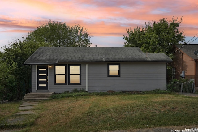 view of front of home featuring a yard