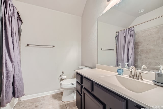 bathroom with toilet, vaulted ceiling, tile patterned floors, vanity, and curtained shower