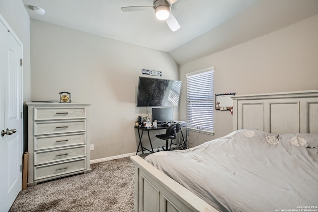 carpeted bedroom featuring vaulted ceiling and ceiling fan