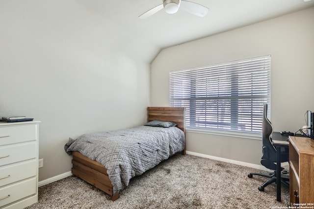 bedroom featuring vaulted ceiling, ceiling fan, and light colored carpet