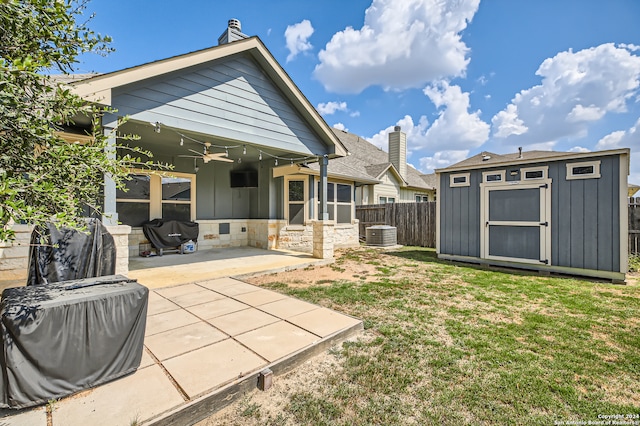 view of yard featuring a patio, a storage unit, ceiling fan, and central air condition unit