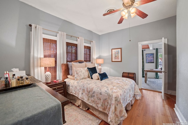 bedroom featuring light wood-type flooring and ceiling fan