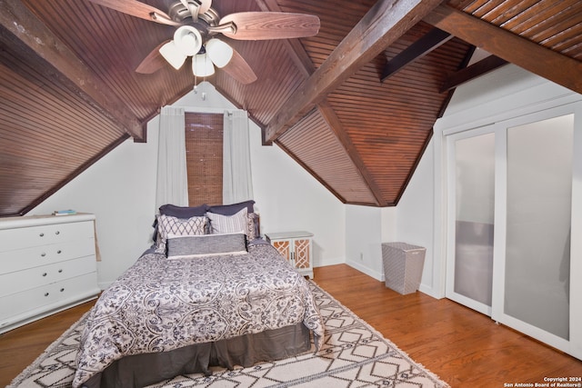 bedroom featuring vaulted ceiling with beams, ceiling fan, hardwood / wood-style floors, and wooden ceiling