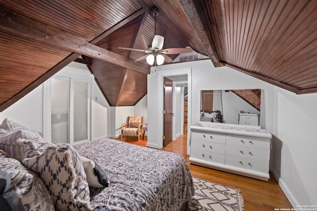 bedroom with wood ceiling, vaulted ceiling with beams, ceiling fan, and light hardwood / wood-style floors