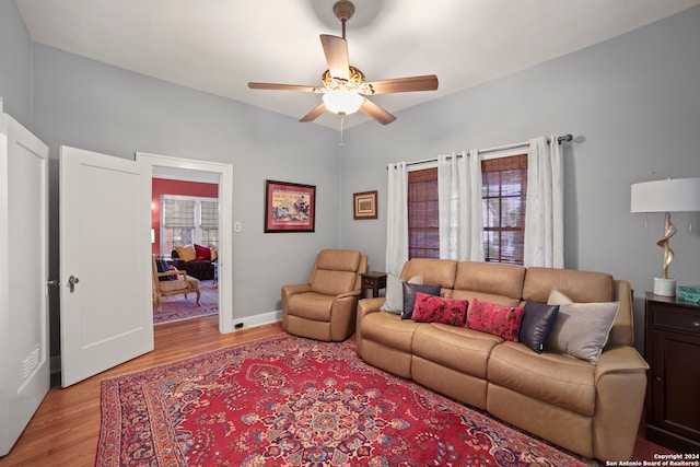 living room with ceiling fan, light hardwood / wood-style floors, and a healthy amount of sunlight