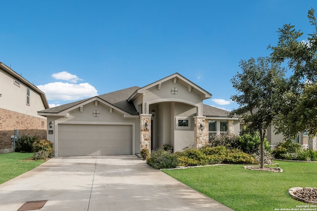 view of front facade featuring a garage and a front lawn