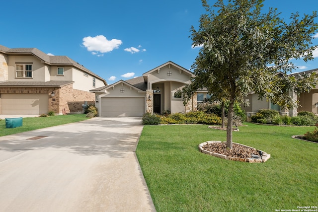 view of front facade featuring a garage and a front yard