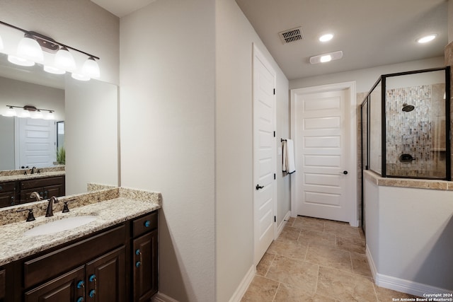 bathroom with vanity and an enclosed shower