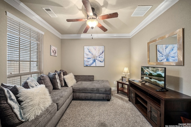 living room featuring ceiling fan, light carpet, and ornamental molding