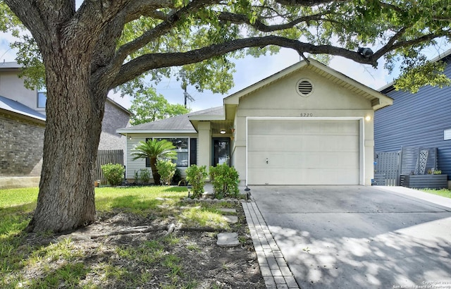 ranch-style home featuring a front yard and a garage