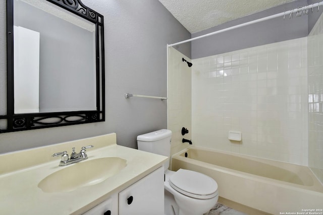 full bathroom featuring a textured ceiling, vanity, toilet, and shower / bathing tub combination