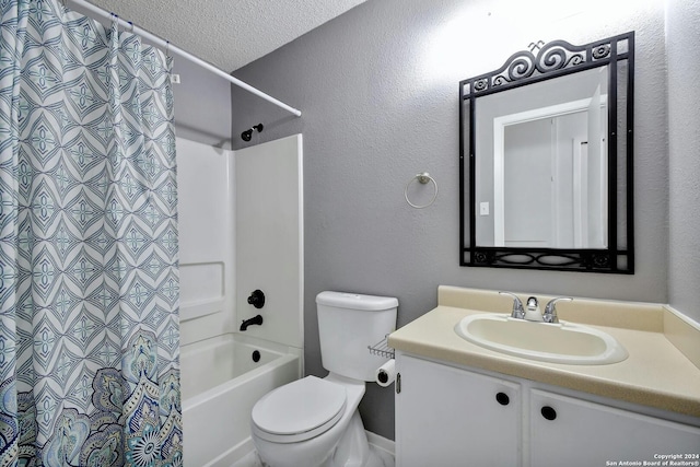 full bathroom with a textured ceiling, shower / bath combo, vanity, and toilet