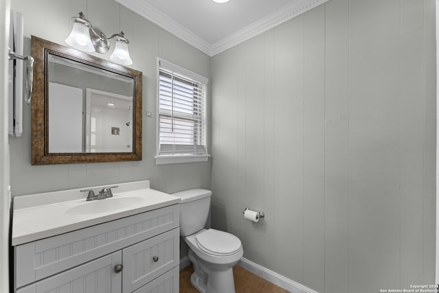 bathroom featuring ornamental molding, vanity, tile patterned flooring, and toilet