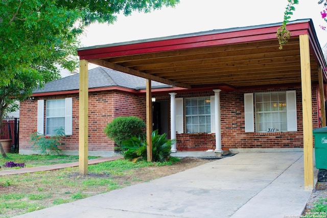 view of patio / terrace featuring a carport