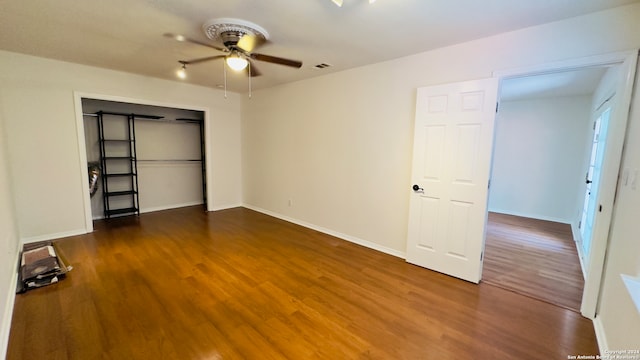 spare room featuring ceiling fan and dark hardwood / wood-style flooring