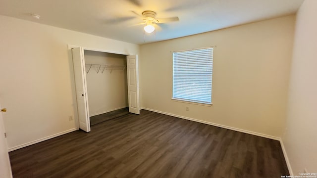 unfurnished bedroom with ceiling fan, a closet, and dark hardwood / wood-style floors