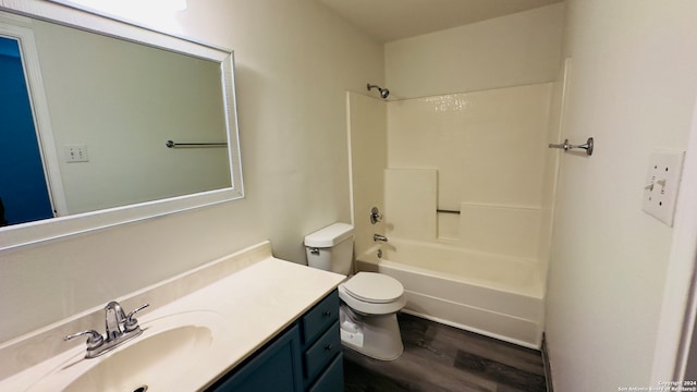 full bathroom featuring vanity, shower / bath combination, toilet, and hardwood / wood-style flooring