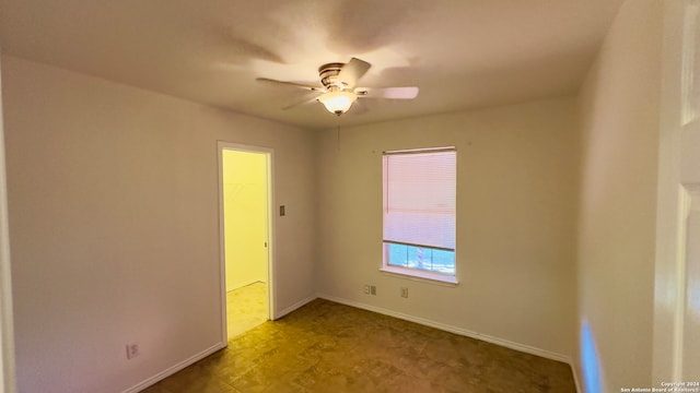 spare room with ceiling fan