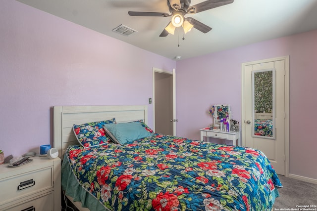 bedroom with light carpet and ceiling fan