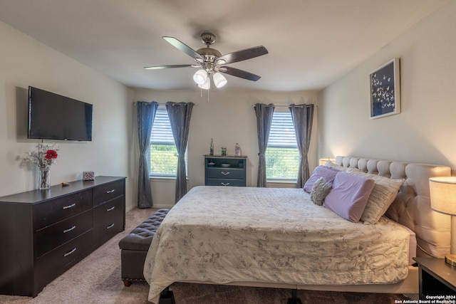 carpeted bedroom with ceiling fan