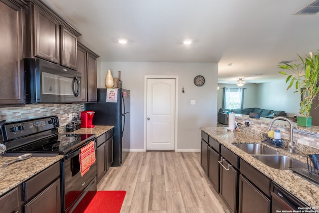 kitchen featuring light hardwood / wood-style floors, black appliances, ceiling fan, dark brown cabinetry, and sink