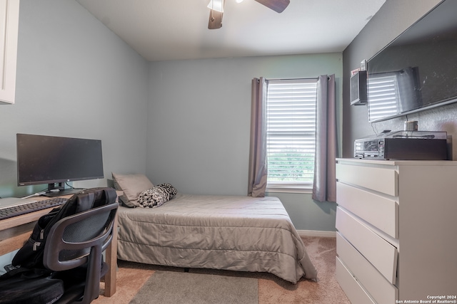 bedroom with light carpet and ceiling fan