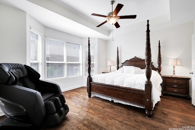 bedroom with ceiling fan and dark wood-type flooring