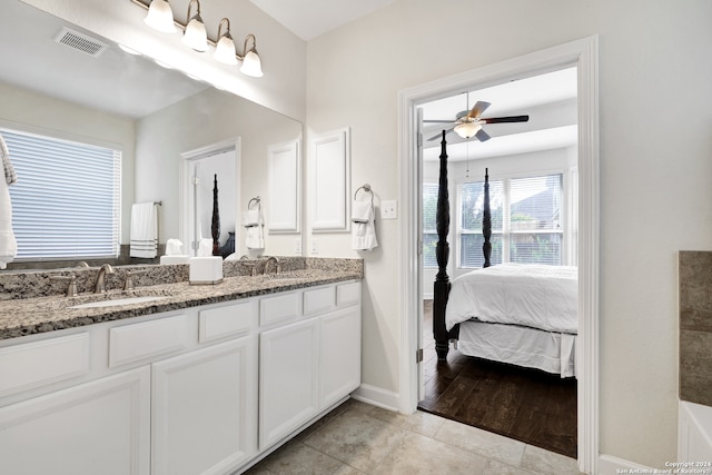 bathroom with vanity, ceiling fan, and hardwood / wood-style flooring