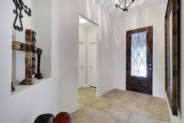 foyer with a chandelier