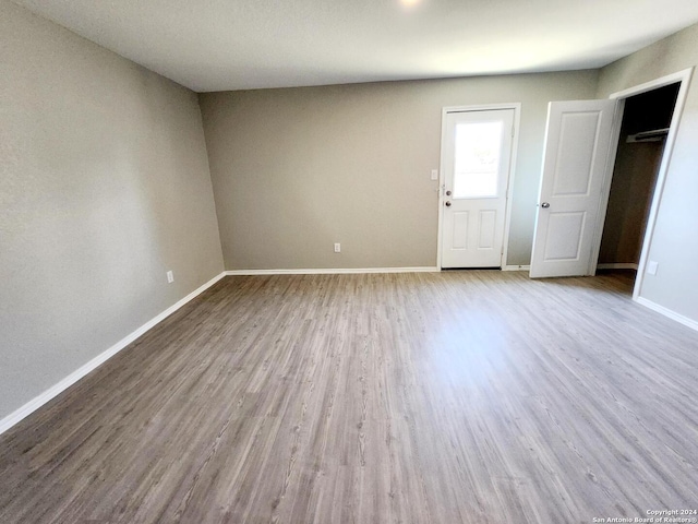 unfurnished bedroom featuring light wood-type flooring