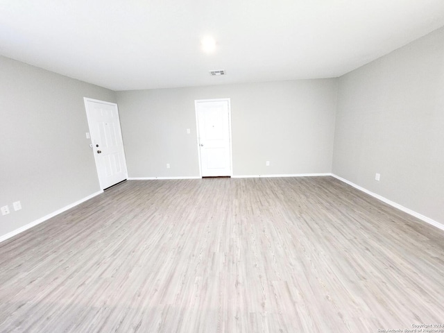 unfurnished room featuring light hardwood / wood-style floors