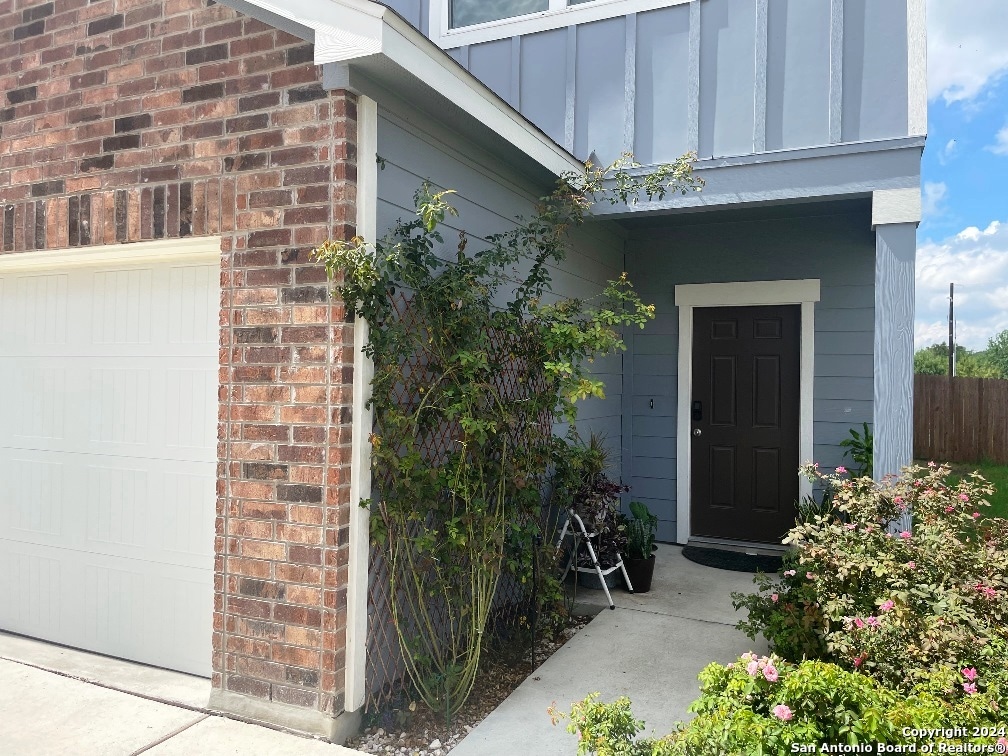 entrance to property featuring a garage